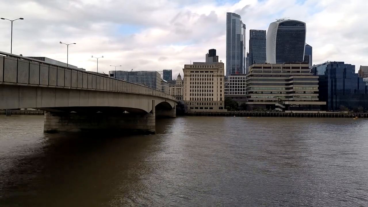 London Bridge crossing the Thames, with the towers of the City of London beyond