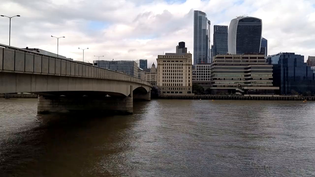 London Bridge crossing the Thames, with the towers of the City of London beyond